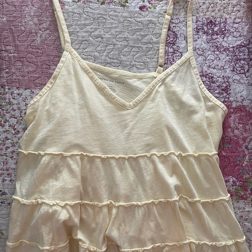 Pale yellow ruffle tank top